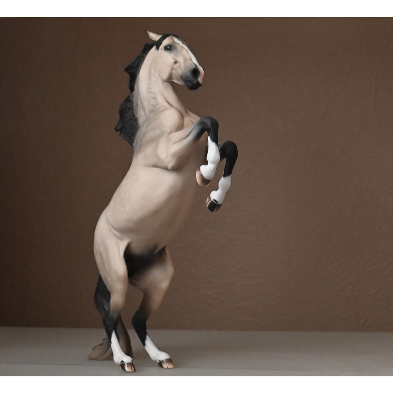 CM Breyer Adonis to a dappled buckskin